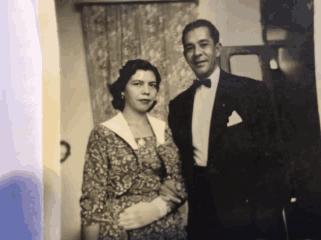a black and white photo of a man and a woman