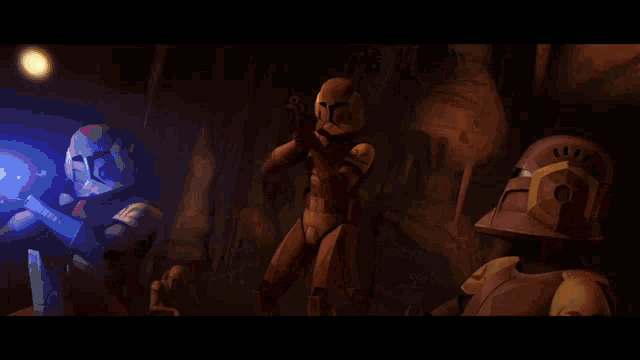 a group of star wars clone troopers are fighting each other in a room .