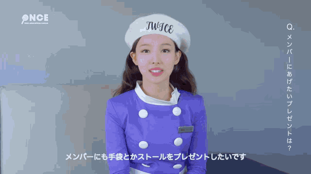a woman wearing a beret that says twice