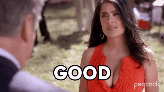 a woman in a red dress is saying good
