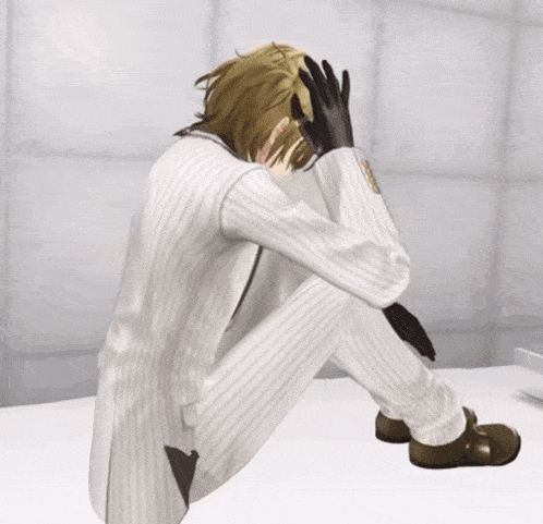 a man in a suit is sitting on a bed with his hands on his head
