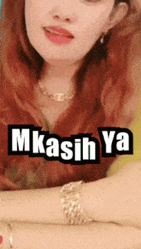 a picture of a woman with red hair and the words mkasih ya on it