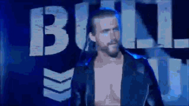 a man is walking in front of a sign that says bull