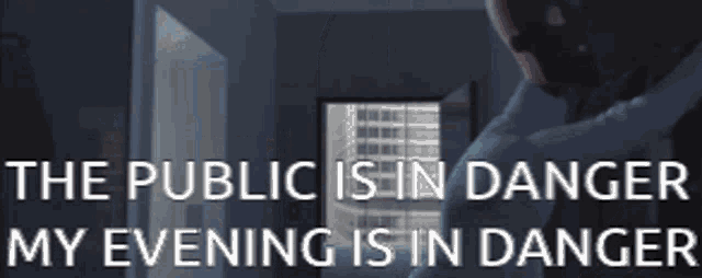 a man is standing in a hallway with the words " the public is in danger my evening is in danger " above him