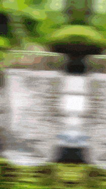 a blurred image of a car driving down a road