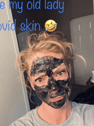 a woman with a black mask on her face with the words " e my old lady " above her