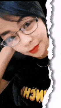 a woman wearing glasses and a black shirt that says " wow "