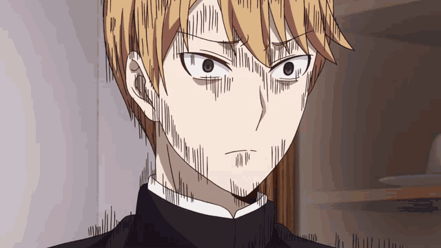 a close up of a man 's face with a very angry look on his face