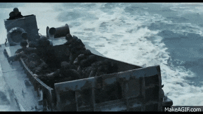 a boat filled with soldiers is floating in the ocean .