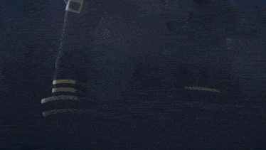 a close up of a person 's face with a blue light coming out of it