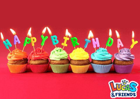 a row of cupcakes with happy birthday candles