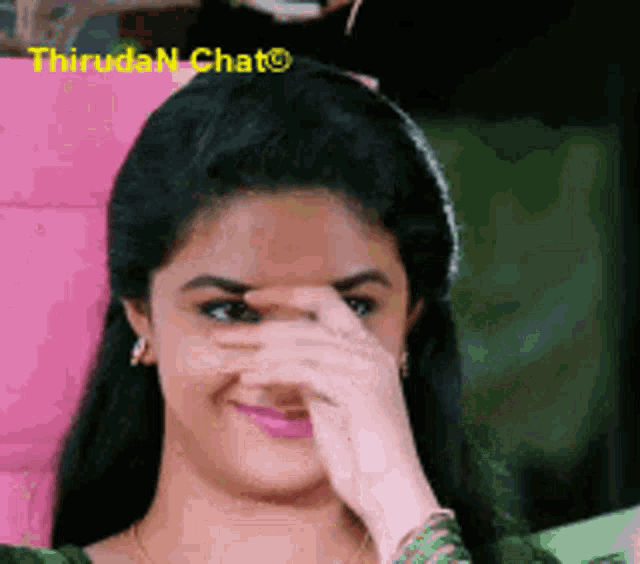 a woman is covering her face with her hand and the words thiruda n chat are on the bottom