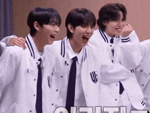 a group of young men are posing for a picture and one of them has a name tag with the letter b on it