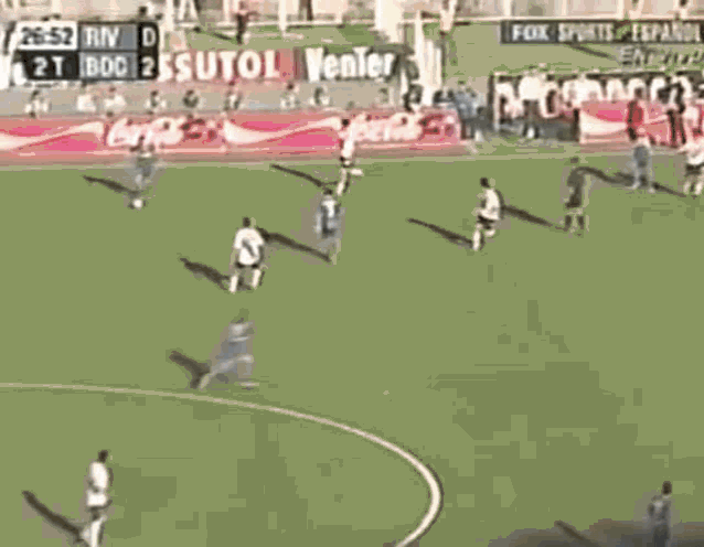 a crowd of people watching a soccer game on fox sports espanol