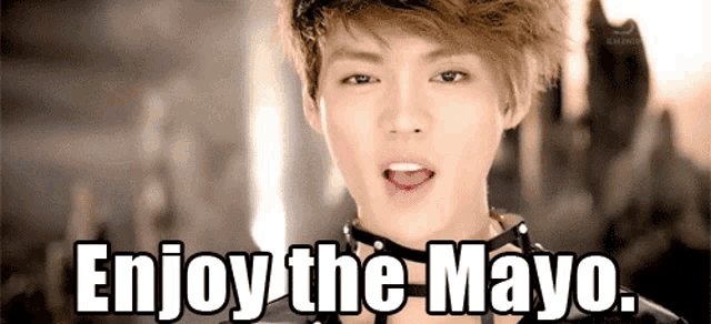 a young man with a choker around his neck is saying " enjoy the mayo "