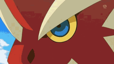 a close up of a cartoon character with fire coming out of its mouth .