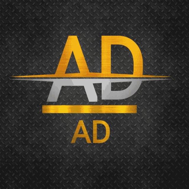 a black and gold ad logo on a metal background