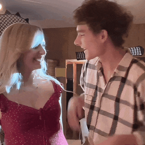 a man and a woman are smiling at each other