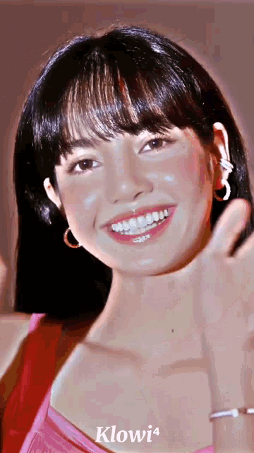 a close up of a woman 's face with the name klowi14 on the bottom left