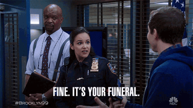a police officer says " fine it 's your funeral " in front of a man and a boy