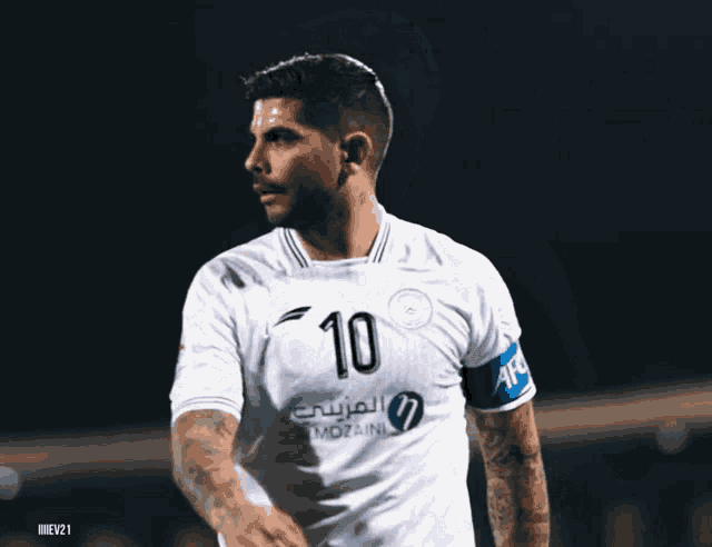 soccer player wearing a white shirt with the number 10 on it