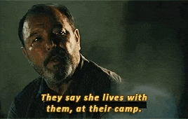 a man with a beard is talking about a woman who lives with them , at their camp .