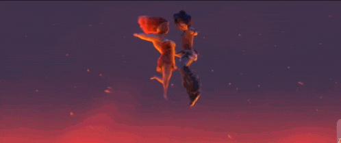 a couple of people are standing in a field of lava with fire coming out of it .
