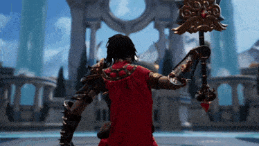 a man in a red cape holding a large sword