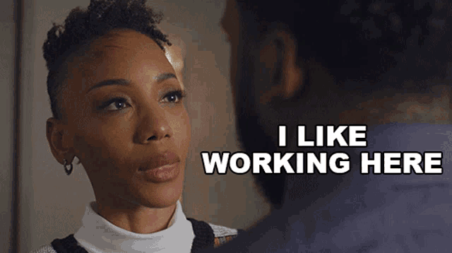 a woman says i like working here while looking at a man