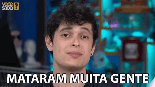 a young man is smiling with the words mataram muita gente below him
