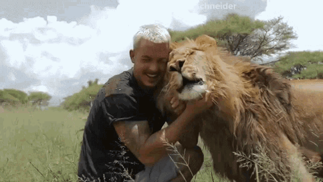 Hugging Dean Schneider GIF - Hugging Dean Schneider Loving Lion GIFs