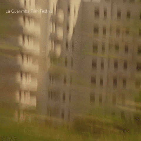 a man and a woman are sitting next to each other and the words la guarimba film festival are visible