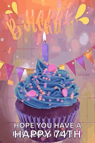 a birthday cupcake with blue frosting and sprinkles and a lit candle