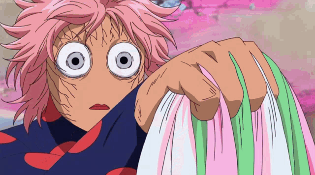 a cartoon character with pink hair and big eyes is holding a piece of cloth