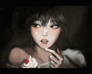 a woman with a ring on her finger is holding a cupcake with a cherry on top