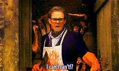 a man in an apron is holding a knife and says i can i can 't