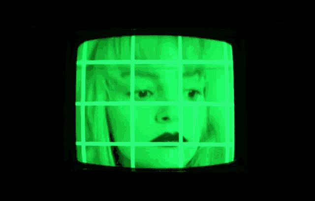 a close up of a man 's face on a television screen .