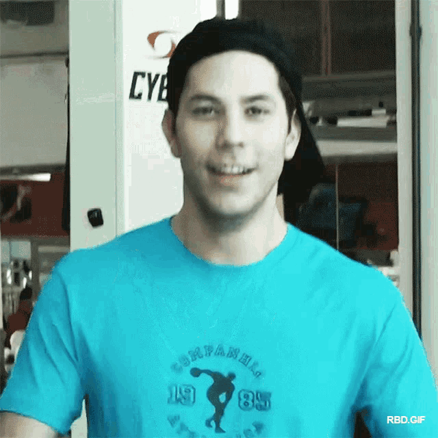 a man wearing a blue t-shirt that says companions 1985