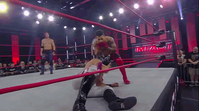 a wrestling ring with the word impact written on it