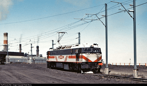 a red white and black train with the letters lnr on the front