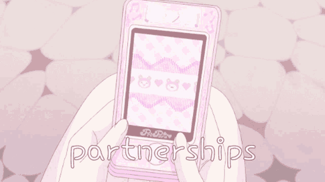 a person holding a pink phone that says partnerships on the bottom