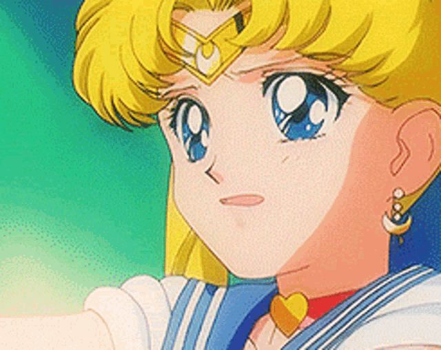 a close up of a girl wearing earrings and a heart necklace