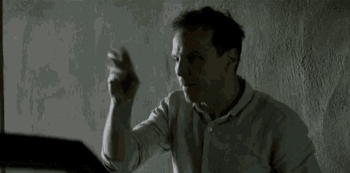 a man is covering his face with his hand