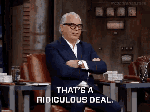 a man in a suit and glasses says that 's a ridiculous deal while sitting in a chair