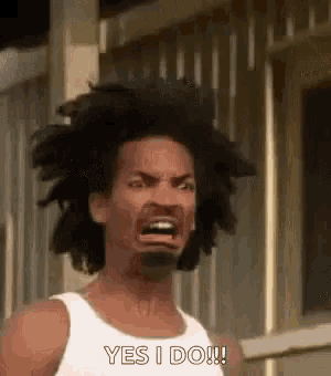a man in a white tank top is making a funny face and saying `` yes i do '' .