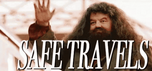 a man with a beard is waving his hand and says safe travels .