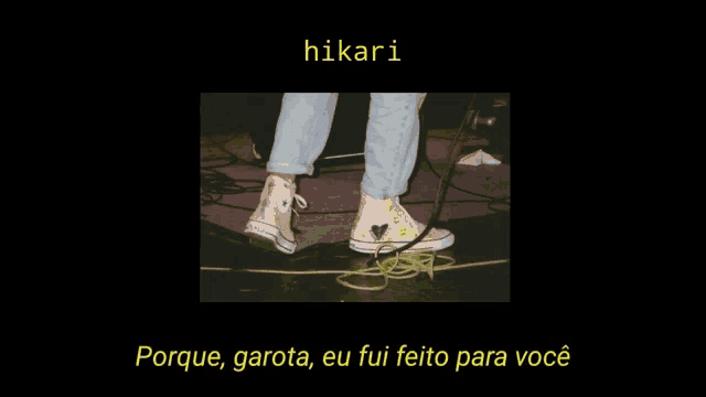 a picture of a person 's feet on a stage with the words hikari in yellow