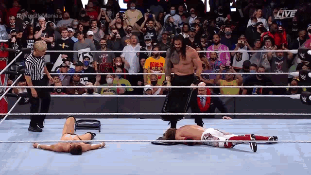 a wrestler with a shirt that says roman reigns