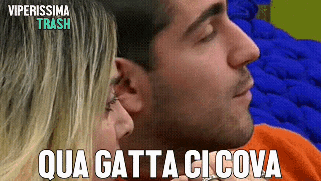 a picture of a man and woman with the words qua gatta ci cova