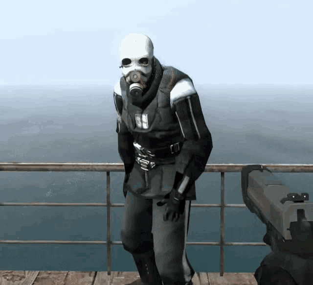 a man wearing a gas mask stands on a balcony overlooking a body of water
